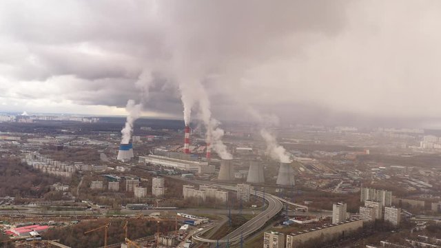 panoramic industrial view of smoke pipes filmed from a drone
