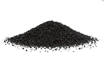 Abrasive powder black superslut in the form of slides on white background. Granulated slag is used for cleaning metal surfaces, from rust and paint.