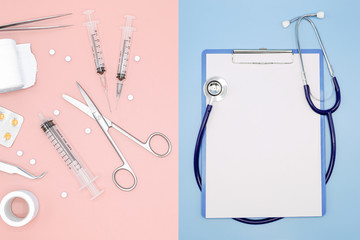 Top view of medicines and medical tools with stethoscope on pastel background, Medical and healthcare concept. Blank for text and copy space.