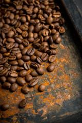 Coffee beans on the rustic background. Selective focus. Shallow depth of field.