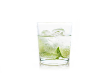 Rum based cocktail caipirinha (variation of cuba libre) on the white background. Selective focus....