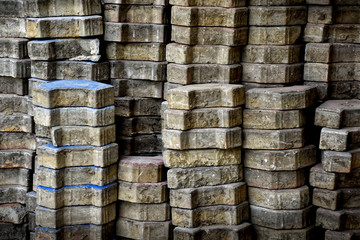 Pile of bricks floor at a construction site, building material concepts