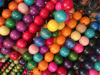 Fototapeta na wymiar wooden colorful bright beads close up