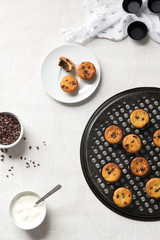 Yogurt mini muffins with cocoa nibs from above