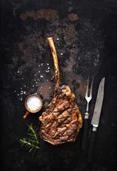 Selbstklebende Fototapeten Grilled tomahawk beef steak with spices © Alexander Raths