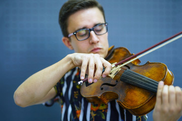 Playing his handmade violin with great success