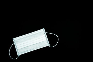 Antivirus mask taken on a black background