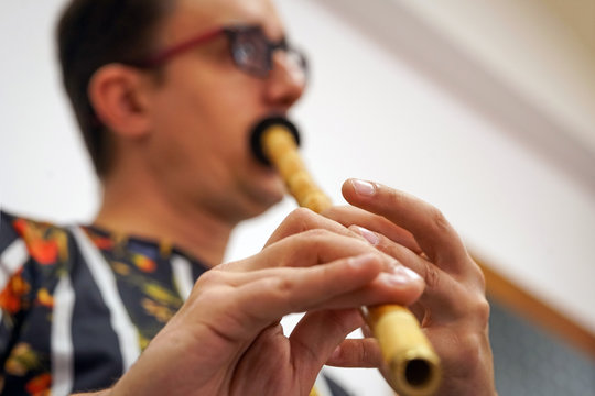 A musician blowing Ney, Close Up