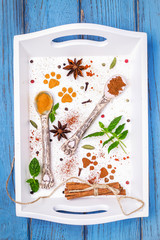 Turmeric, paprika, star anise, pepper, cardamom, sticks of cinnamon and mint on white background. Spices