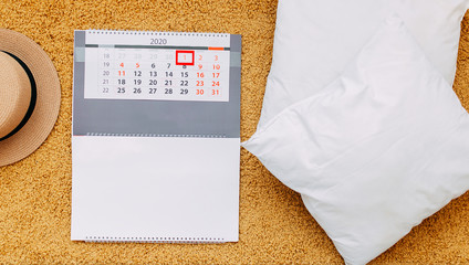 When quarantine is over, 2020 calendar, a hat and white pillow on orange plaid.