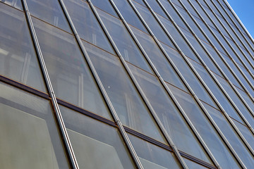 Close up of a window of a tall office building. Many windows.