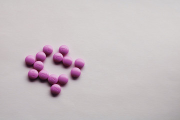 purple tablets on a white background