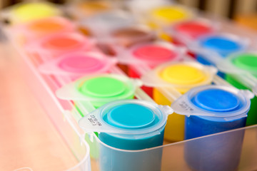 Palette of ready mix poster paint in small cans