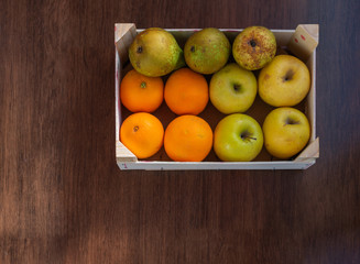 overhead view of box with assorted fruit