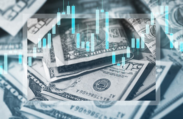 US dollar bills and candlestick chart showing changes in price of money