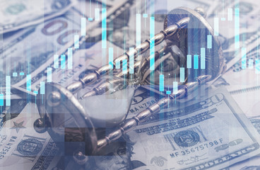 Candlestick chart, hourglass and US dollar bills
