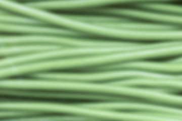 abstract background of lines or stems that look like wires, green color, blur