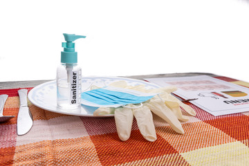Conceptual of the new normal lifestyle with usage of sanitizer, face mask, gloves and disposable...