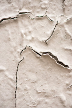 cracks on old white wall