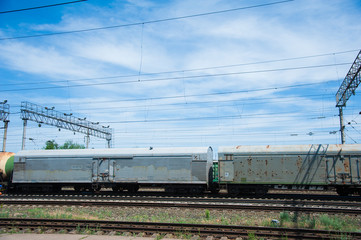 Fototapeta na wymiar Freight train crossing through railroad station