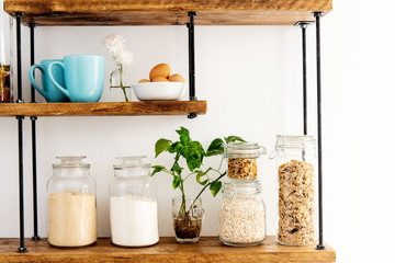 glass jars with flour and sugar on shelves
