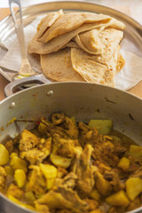 dhal puri and curried chicken in a pot