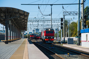 The locomotive of the train arrives at the station
