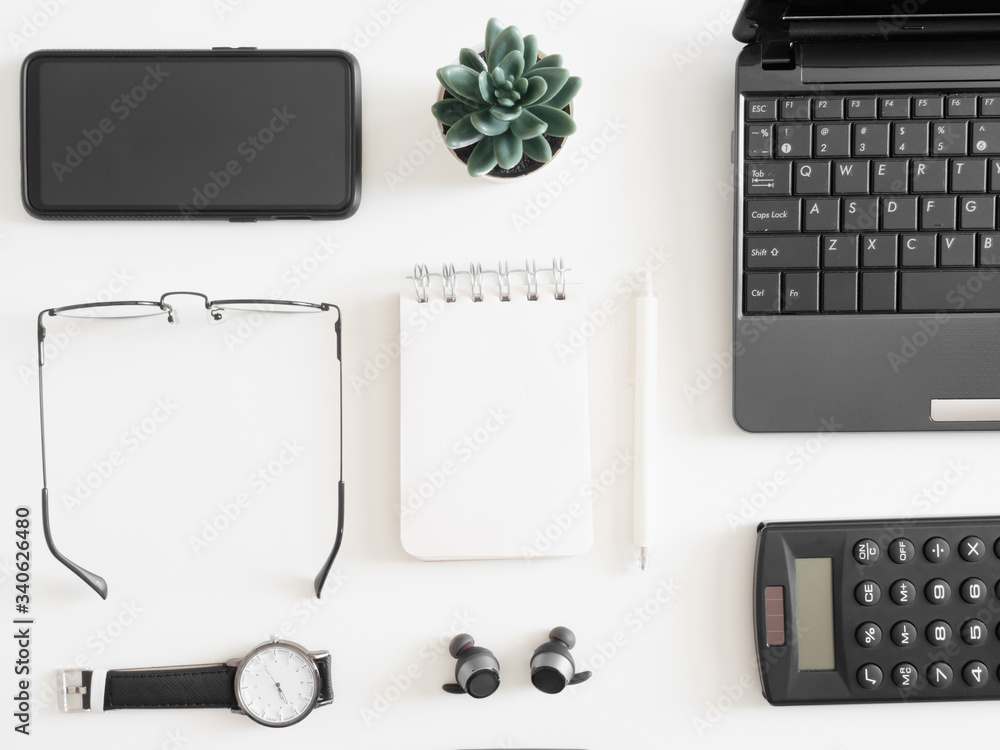 Fototapete top view of work from home concept with keyboard, calculator and notebook on white background, graph