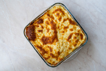 Baked Pasta Noodle with Bechamel Cheese Sauce and Spinach / Ziti Bolognese in Glass Bowl.