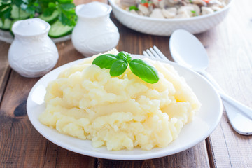 mashed potatoes on a white plate, selective focus