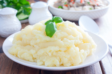 mashed potatoes on a white plate, selective focus