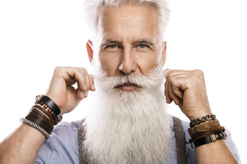 Handsome bearded senior man on white background