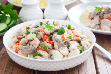 Chicken fillet with mushrooms in sour cream sauce, selective focus