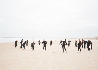 PENICHE, PORTUGAL - SEPT 29, 2019: Surf school. Group of surfers stretching