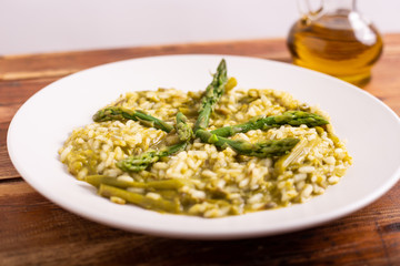 Risotto with asparagus. Typical dish of the Italian tradition, healthy and light. Ideal for a summer lunch
