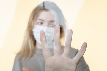 Stay at home because of covid and quarantine. Young woman alone at home in pandemic situation