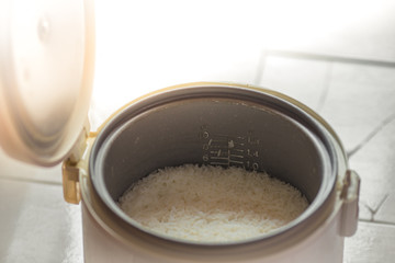 The blurred background of the smoke rising out of the rice cooker, the aroma of food fragrance, seen from the cooking in a condo or house.