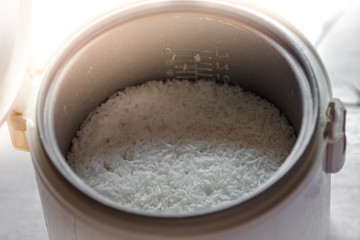 The blurred background of the smoke rising out of the rice cooker, the aroma of food fragrance, seen from the cooking in a condo or house.