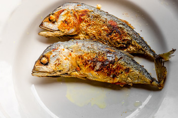 background of the fried fish menu (mackerel)that is fried in fish sauce until the skin is scorched,eaten with steamed rice,an alternative health menu that people like to order in restaurants