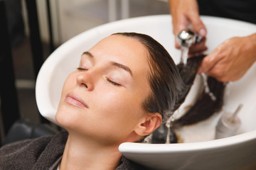 Young woman in hairdresser salon