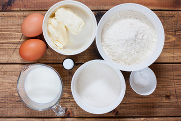 Fototapeta na wymiar Step-by-step preparation of vanilla muffins, step 1 - preparation of ingredients, top view, horizontal