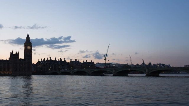 Timelapse of a sunset behind Houses of Parliament and Big Ben clock tower with Westminster Bridge near River Thames, Westminster, London, United Kingdom