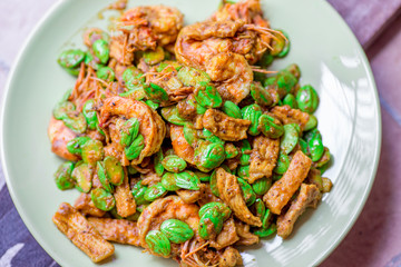 blurred background view of the spicy southern Thai food(stir-fried spicy Sato with fresh prawns),which has a mixture of colorful spices catching the customers, a popular menu eaten with steamed rice