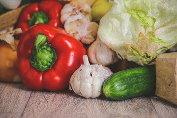 Close-up on a background of light countertops onion turnip, garlic, red pepper.
