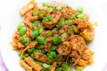 blurred background view of the spicy southern Thai food(stir-fried spicy Sato with fresh prawns),which has a mixture of colorful spices catching the customers, a popular menu eaten with steamed rice