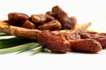 dates fruit whit leaves isolated on white background