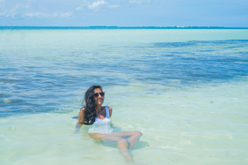 Young indian woman happy in the sea