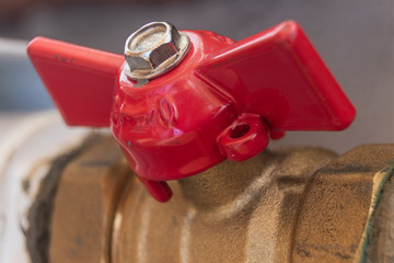Red used shut-off valve close-up