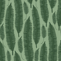 Vector seamless background with green fern leaves. Pattern for the fabric.