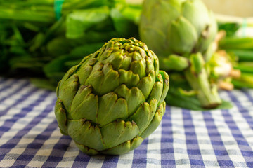 Natural raw vegetables on blue table.